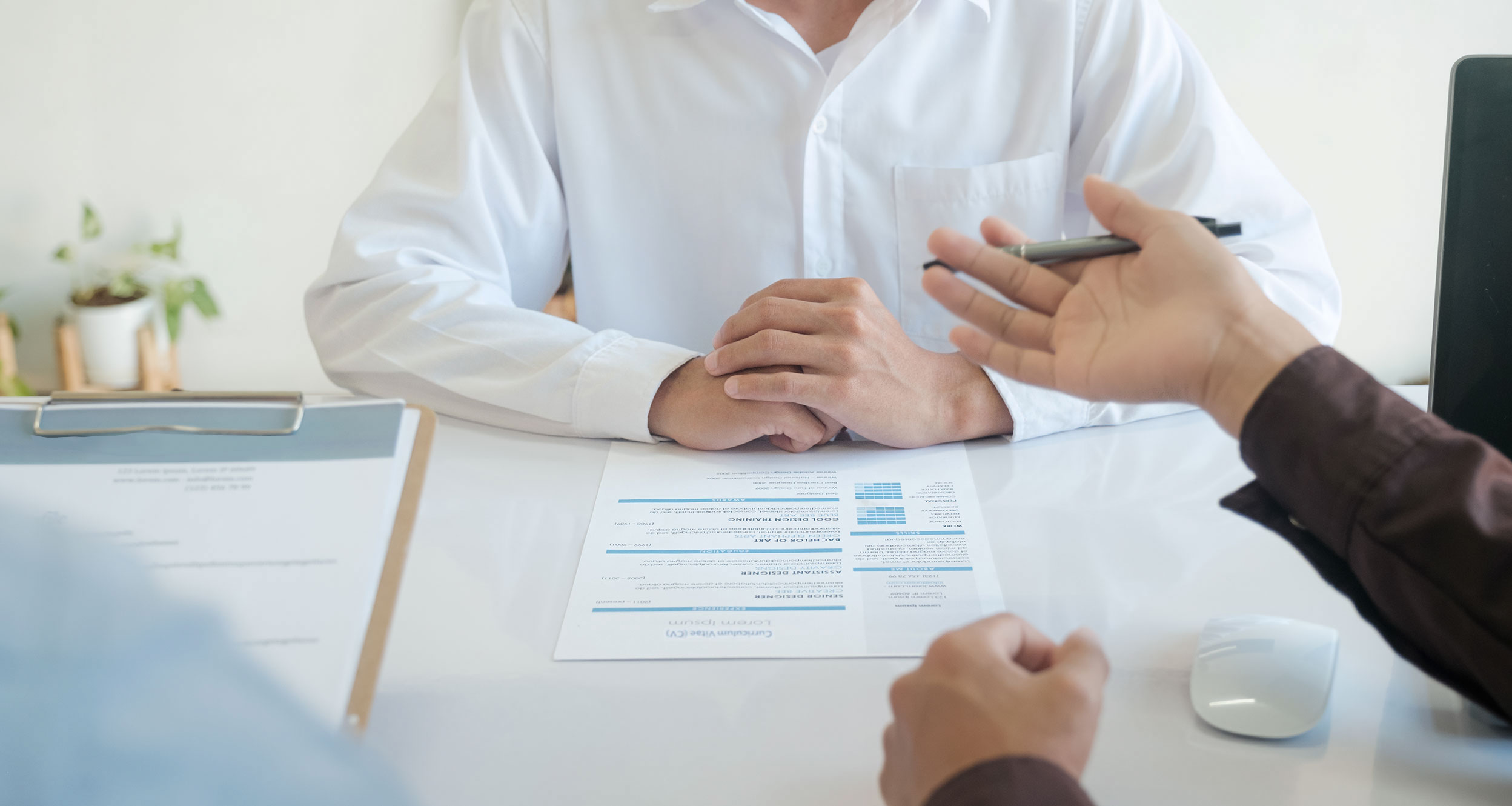 two people are at a table with a CV