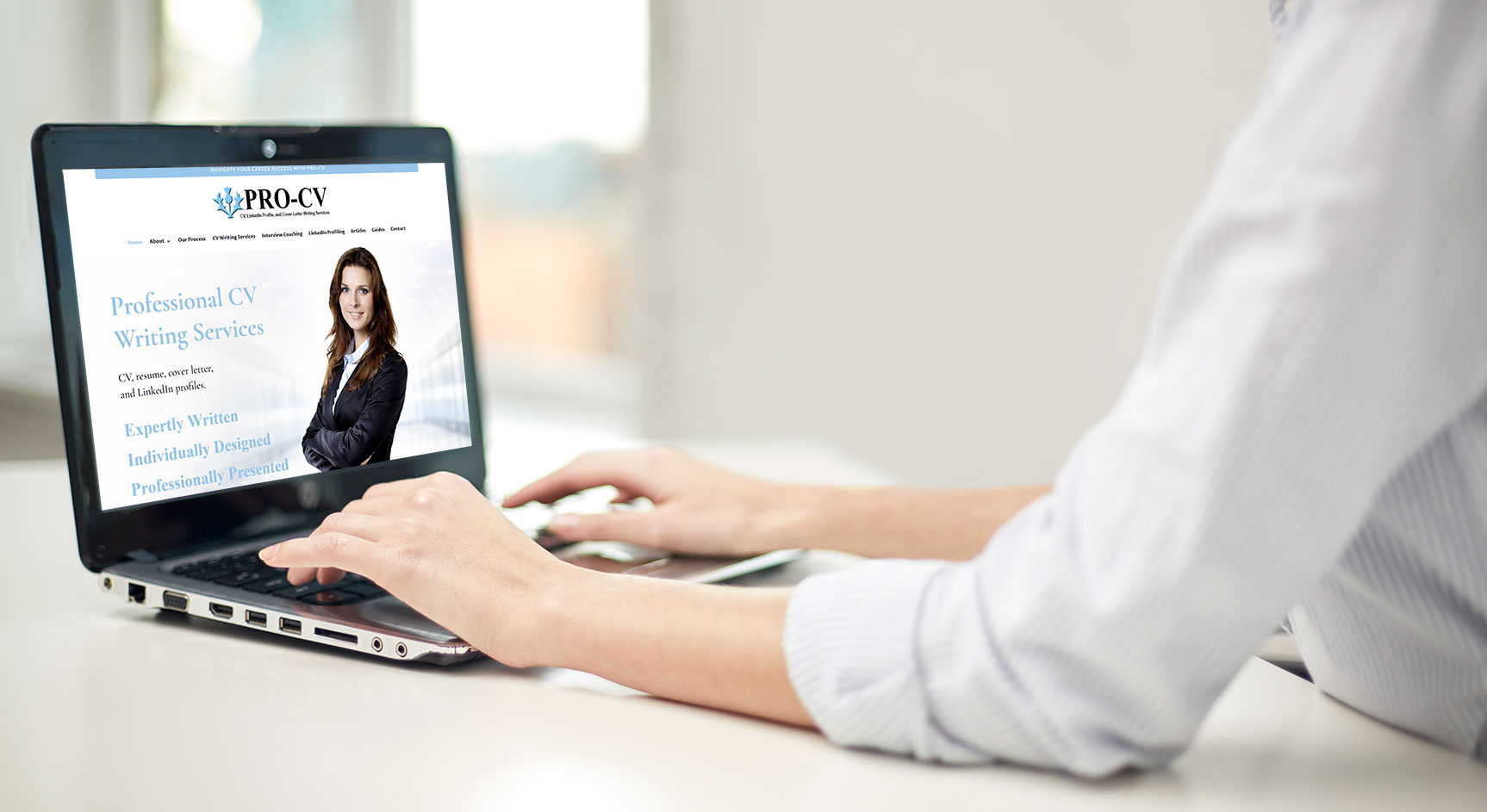 Writer typing on laptop at office